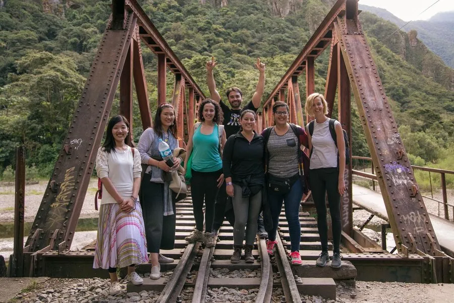 Tourists walking along the railway line towards Machupicchu from the hydroelectric plant